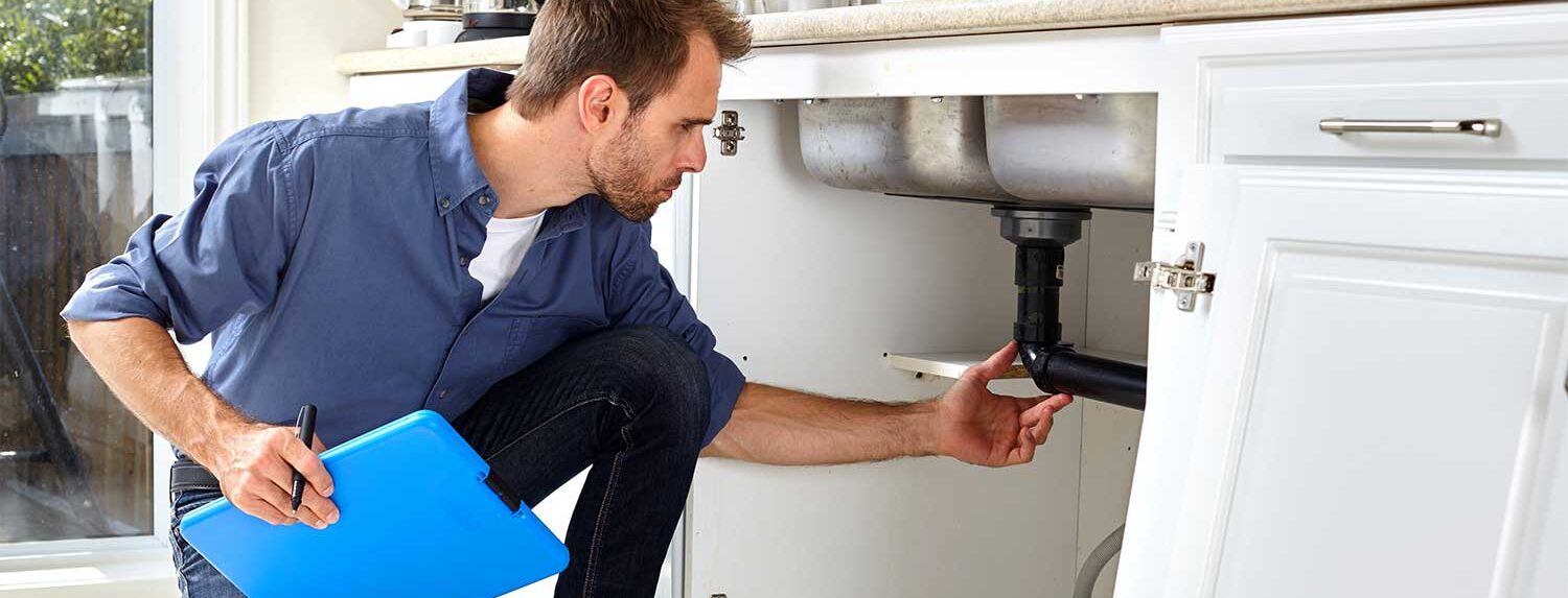 A pre-purchase plumbing inspection being completed by a Hervey Bay plumber